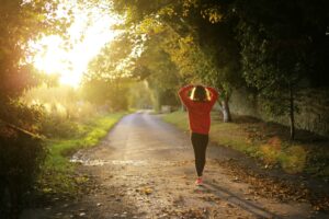 Woman walking on serene country road